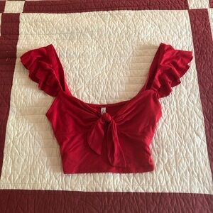 Red crop top. Bow in front.